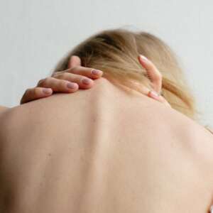 Neck & shoulder soreness (Photo by Klara Kulikova on Unsplash)