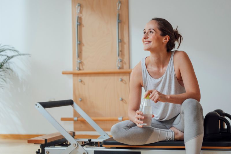 An image of woman relaxing after clinical pilates session