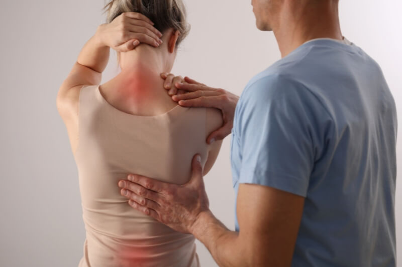An image of a women relieving from back pain