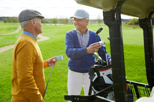 two old men playing golf