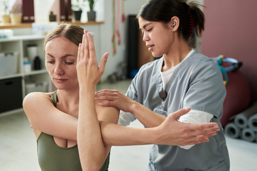 Person stretching their arms and shoulders, the kind of mobility work that keeps the shoulder healthy